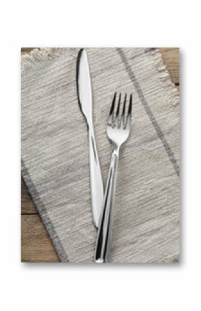 Fork, knife and napkin on wooden table, top view. Stylish shiny cutlery set