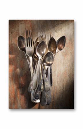 Antique silverware on a wooden table