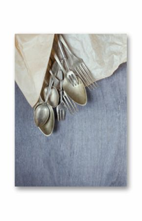 Vintage cutlery on wooden background