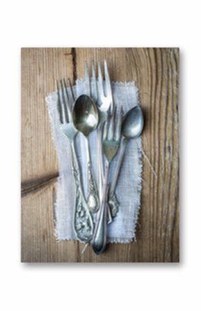 Vintage cutlery on a wooden background