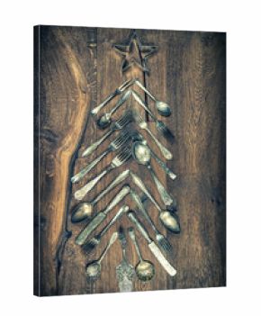 Christmas tree decoration cutlery wooden background vintage