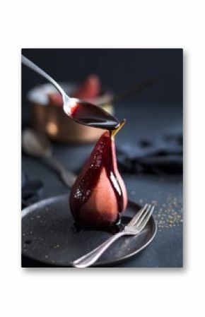 Poached pear in port wine with spices