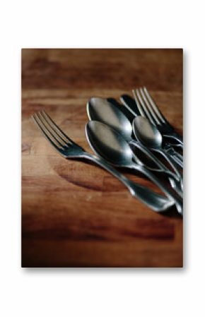 Old cutlery on a wooden background