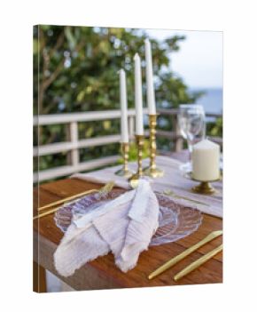White and Gold Romantic Wedding Table Top Layout Table Spread no people no human tropical location with gold cutlery and scenic view tablescape