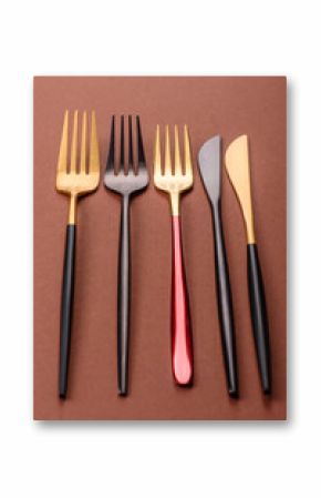 Knife and fork, cutlery on a brown dining table