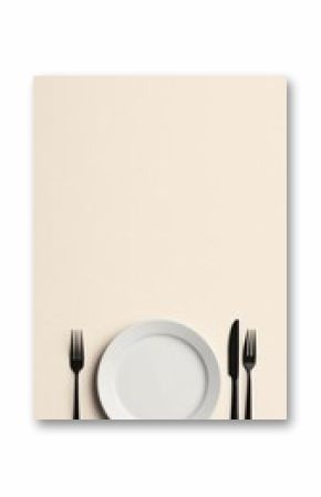 Minimalist table setting  white plate, black cutlery on beige background  simple, elegant, empty