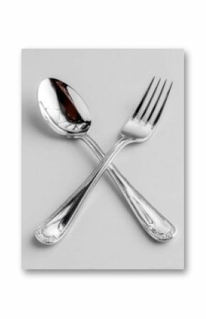 Elegant Silver Spoon and Fork Crossed for Dining Setting