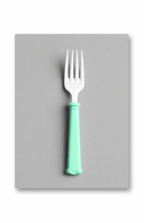 Mint Green Plastic Fork on Grey Background