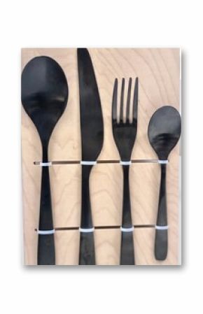 Black Cutlery Set Mounted on Wooden Board