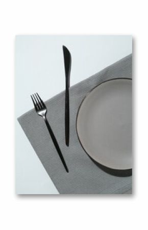 Stylish plate, cutlery and napkin on white background, flat lay