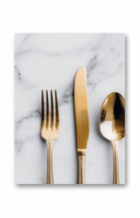 Gold cutlery fork knife spoon marble background minimal luxury style elegant dining reflective surface vertical composition sophisticated modern