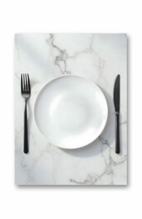 Minimalist white ceramic plate with black cutlery on marble table background, modern elegant dining setting with fork and knife, clean stylish flat lay composition
