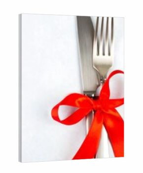 Elegant cutlery with red ribbon