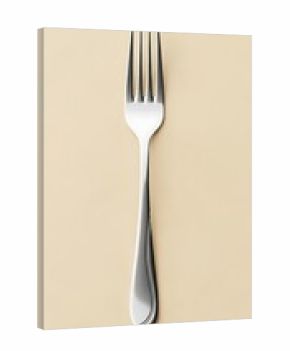Elegant silver fork gleaming on a pale surface ready for a delicious fine dining meal