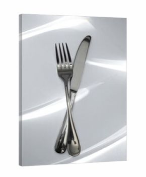 Silverware on a white surface