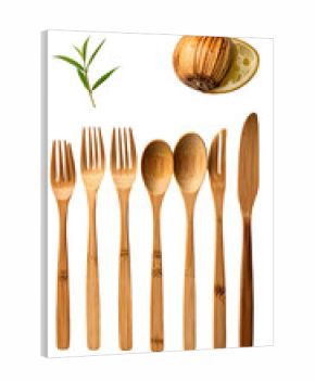 Six natural bamboo utensils, two forks, two spoons, and two knives, arranged vertically against a black background with rosemary and a lemon half