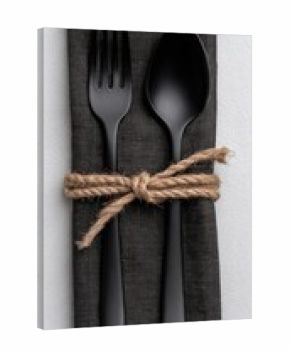 Black cutlery set on a dark grey napkin