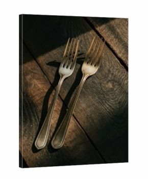Vintage silverware forks on rustic wooden table antique cutlery food concept
