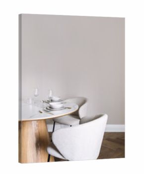 Elegant dining setup with white dishes and cutlery on a marble table
