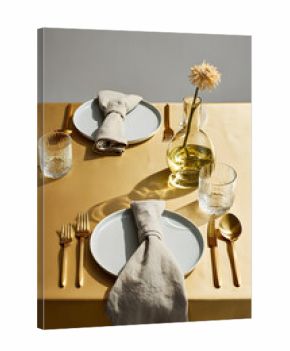 Elegant table setting with gold cutlery