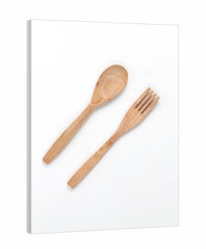 Spoons and forks made of teak wood isolated on white background. Traditional cutlery with a rustic feel
