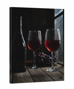 Two Glasses of Wine and Bottle Next To Window