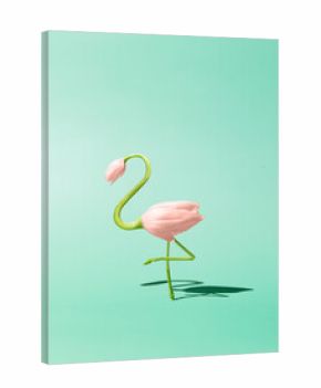 Contemporary art still life concept. Flamingo made from pink tulip flowers. Spring and summer green background. Flamingos Lover
