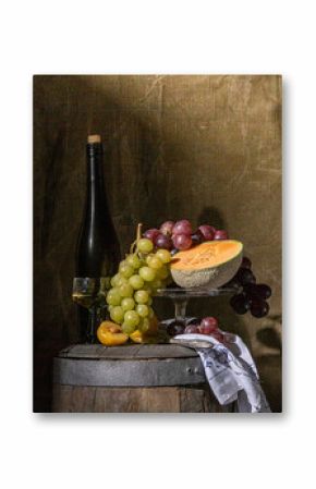 still life of fruit and wine standing on an old wine barrel