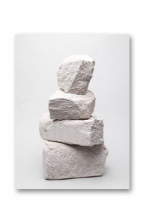 Minimalistic composition with natural porous white stones on a gray background