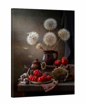 Rustic still life with tomatoes, dandelions and sunflowers