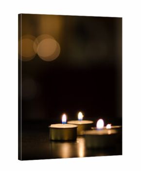 Small candles with dark background