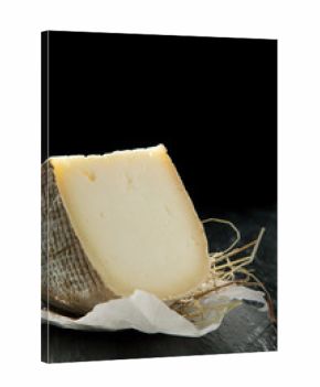 Wedge of Semi-Soft Cheese on Textured Counter