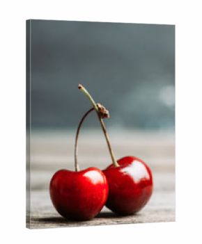 Ripe and juicy cherries on the dark rustic background. Selective focus. Shallow depth of field.