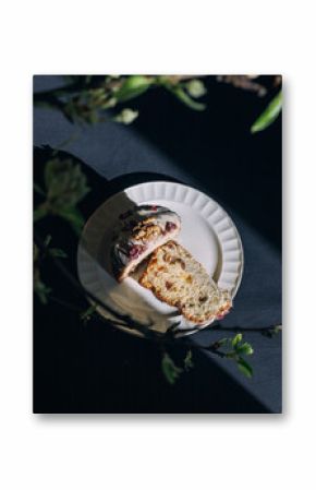 Easter cake on a white plate on a dark table.