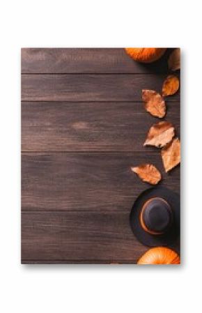 Minimal Halloween Decor with Geometric Pumpkins and Autumn Leaves on Rustic Wood