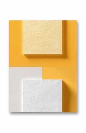 Two rectangular pieces of textured paper, one pale yellow, one white, displayed on a split orange and gray background