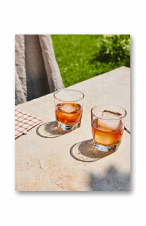 Couple glasses of whiskey coctails outside on the table
