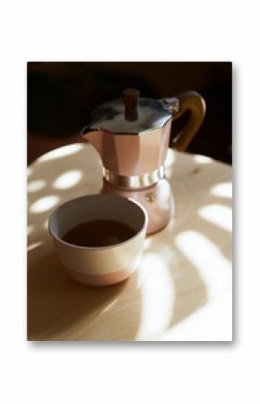 Geyser coffee maker with coffee cup