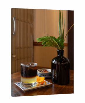 Orange black coffee in a cozy cafe