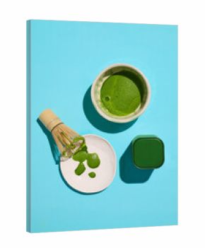 matcha tea preparation essentials against a vibrant blue backdrop