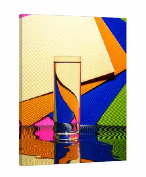 Abstract still life with a glass of water on a color bright background
