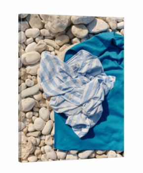 Still life detail of personal items of clothing in the beach