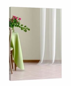 A still life image featuring a vase of pink flowers on a table covered with a green tablecloth, a wooden chair, and a sheer white curtain, all in soft, natural