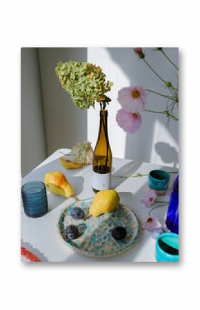 still life of flowers and fruits on the table