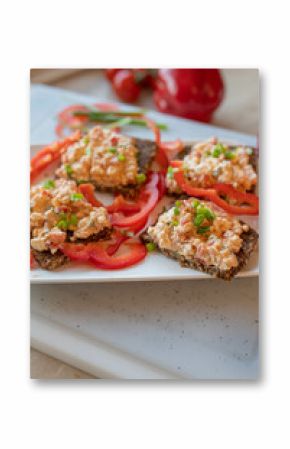 Healthy cottage cheese sandwiches mit peppers on a plate.