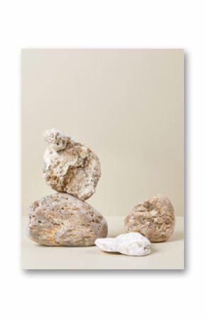 Abstract nature scene with composition of beige and white stones. Neutral background for cosmetic or beauty product branding and packaging mockups. Natural pastel colors. Copy space, front view.