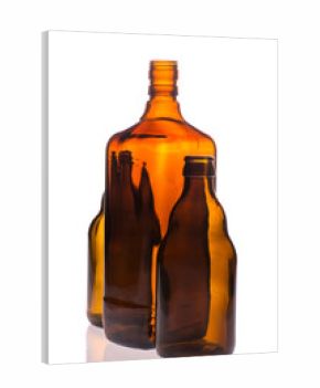 Still life with brown bottles on a white background