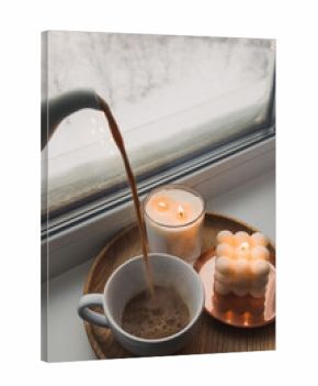 Winter still life with hot drink and candles