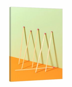 Matchsticks on a green background. Top view.