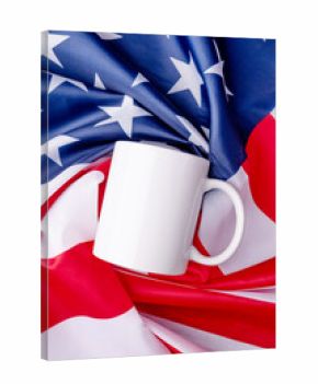 Blank white cup for mockup design over USA flag background